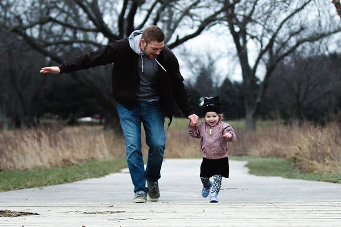 Father and daughter walking in the park
